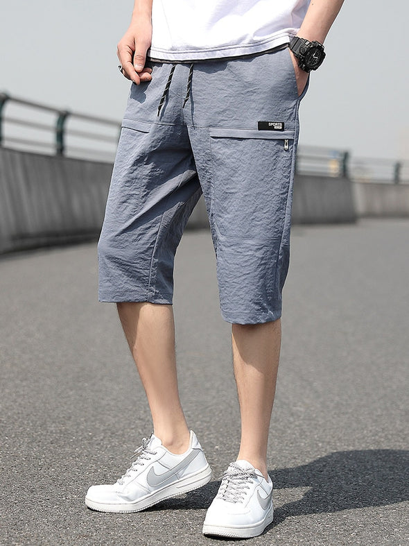 Sweatpants  Summer Wear  Summer Capris Pants  Straight Fit  Plus Size  Men's Calf-Length Shorts  Loose Casual Style  Fashionable and Functional  Cropped Trousers  Cool and Comfortable  Casual and Relaxed Look.  Breathable Fabric